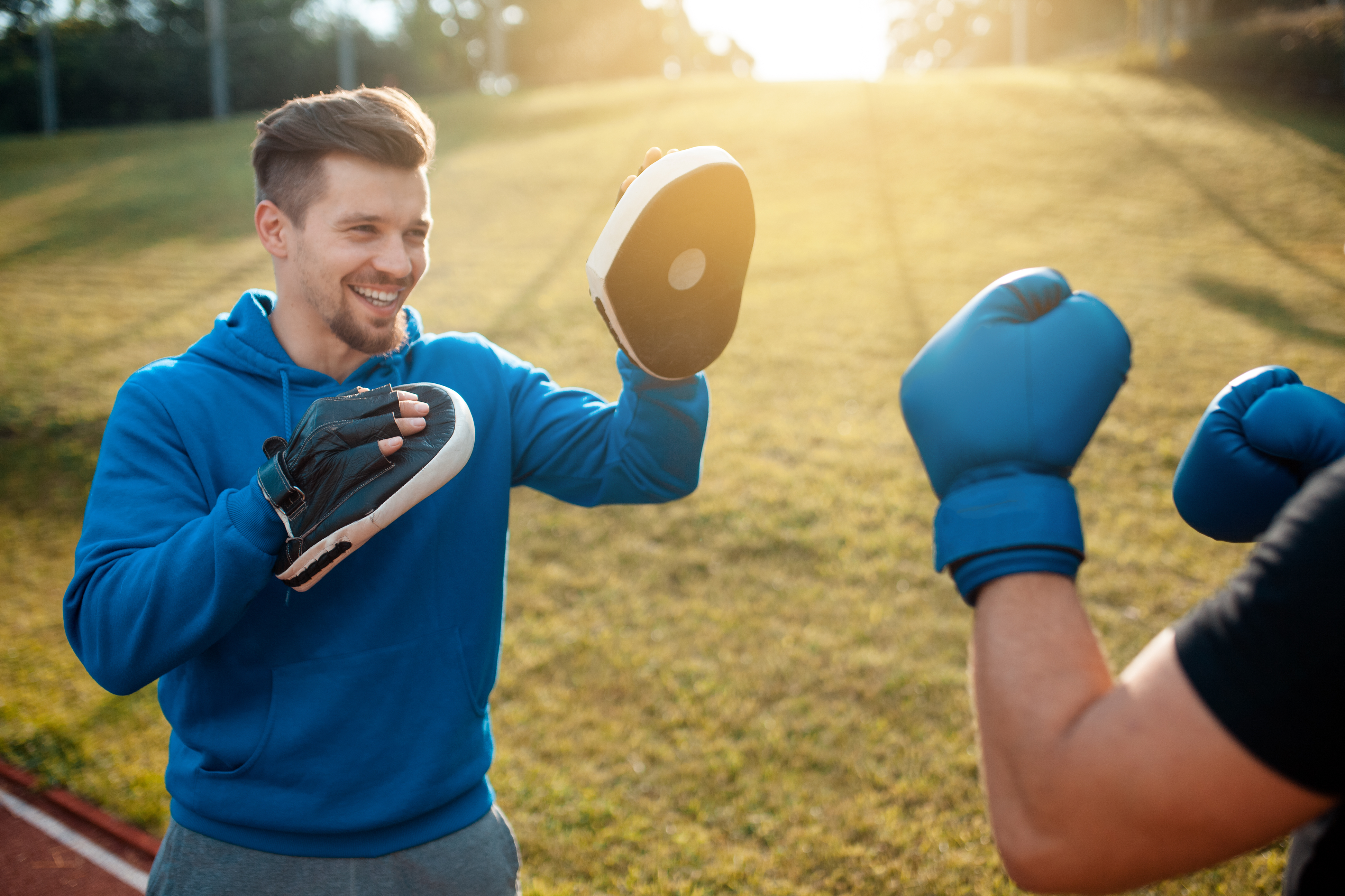 Boxing coach with client